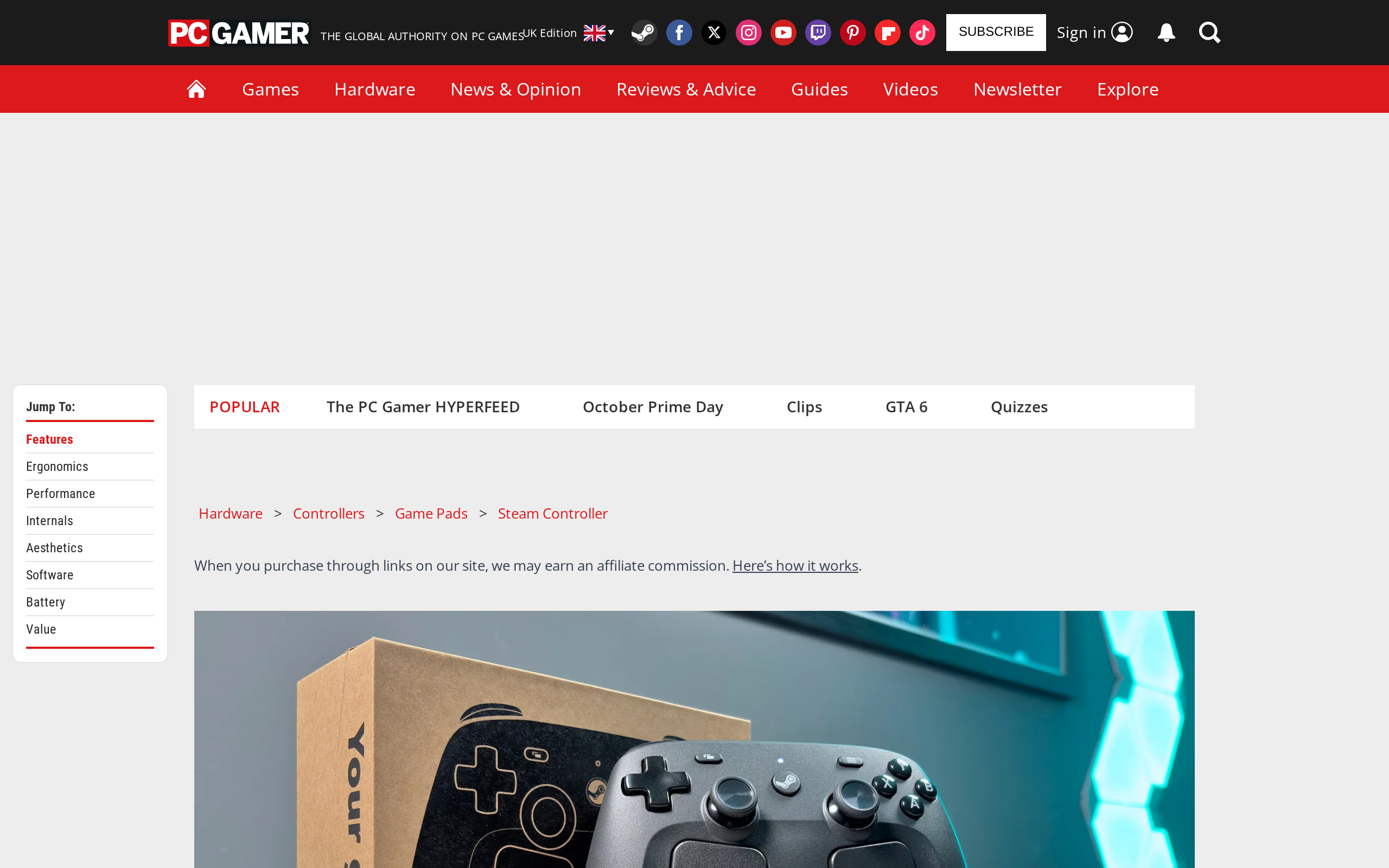 PC Gamer's Steam Controller (2026) review page, with a photo of the controller on a desk during a teardown, parts removed